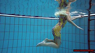 Blonde in a dress in a pool