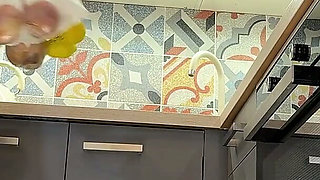 The Juggler Girl Is Here in a Long School Type Uniform Skirt to Flash Her Panties Under Her Miniskirt in the Kitchen