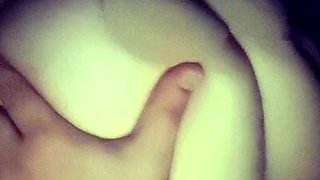 A super sexy brunette massages her big boobs