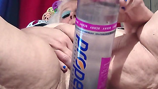 Big Bottle Plugged Clit Cunt