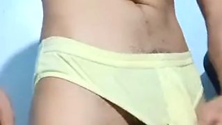 Horny gymnast strokes his huge throbbing cock in lingerie