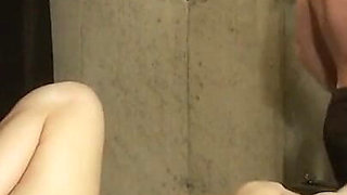 Chained teen enjoys hot wax punishment and dildo penetration