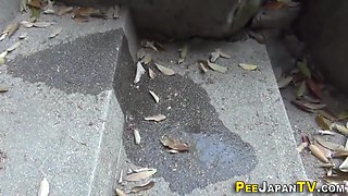 Asian In Alley Urinating While Squatting