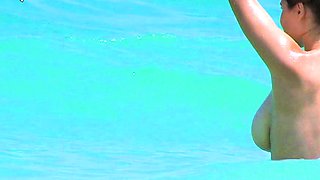 Smoothest nudist play in the warm water  at a nudist beach