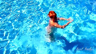 Busty Mature Redhead Melanie Goes For A Swim In The Pool