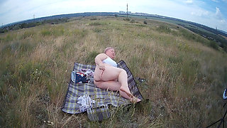 Fat Woman Masturbates With a Toy in the Field