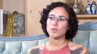 Tattooed black-haired masturbates with her fingers